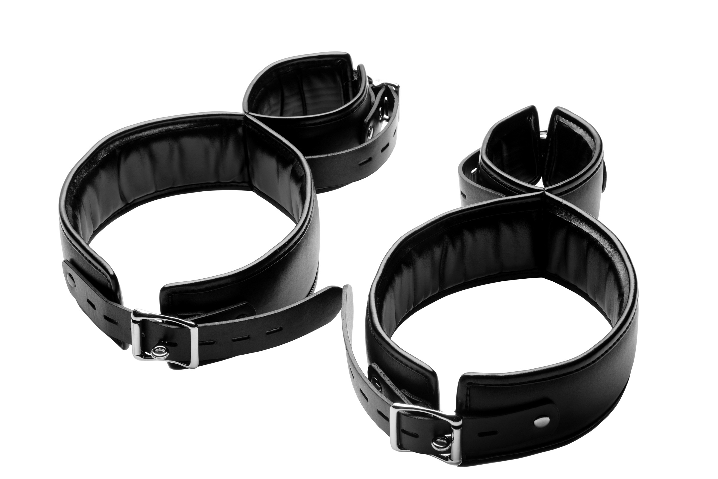 Your play thing will not be able to move their wrists when you bind them with this unique cuff set. Each restraint buckles around the thigh and connects to a wrist restraint. All four buckles are made with a unique locking system that allows you to keep them captive. Each wrist and thigh restraint is fully adjustable and padded for comfort. Put them into whatever position you desire and they will be trapped for your enjoyment! Measurements: Thigh cuffs adjust between 20.5 and 26 inches in circumference. Wrist cuffs adjust between 7 and 12.5 inches in circumference. Material: PU Leather
