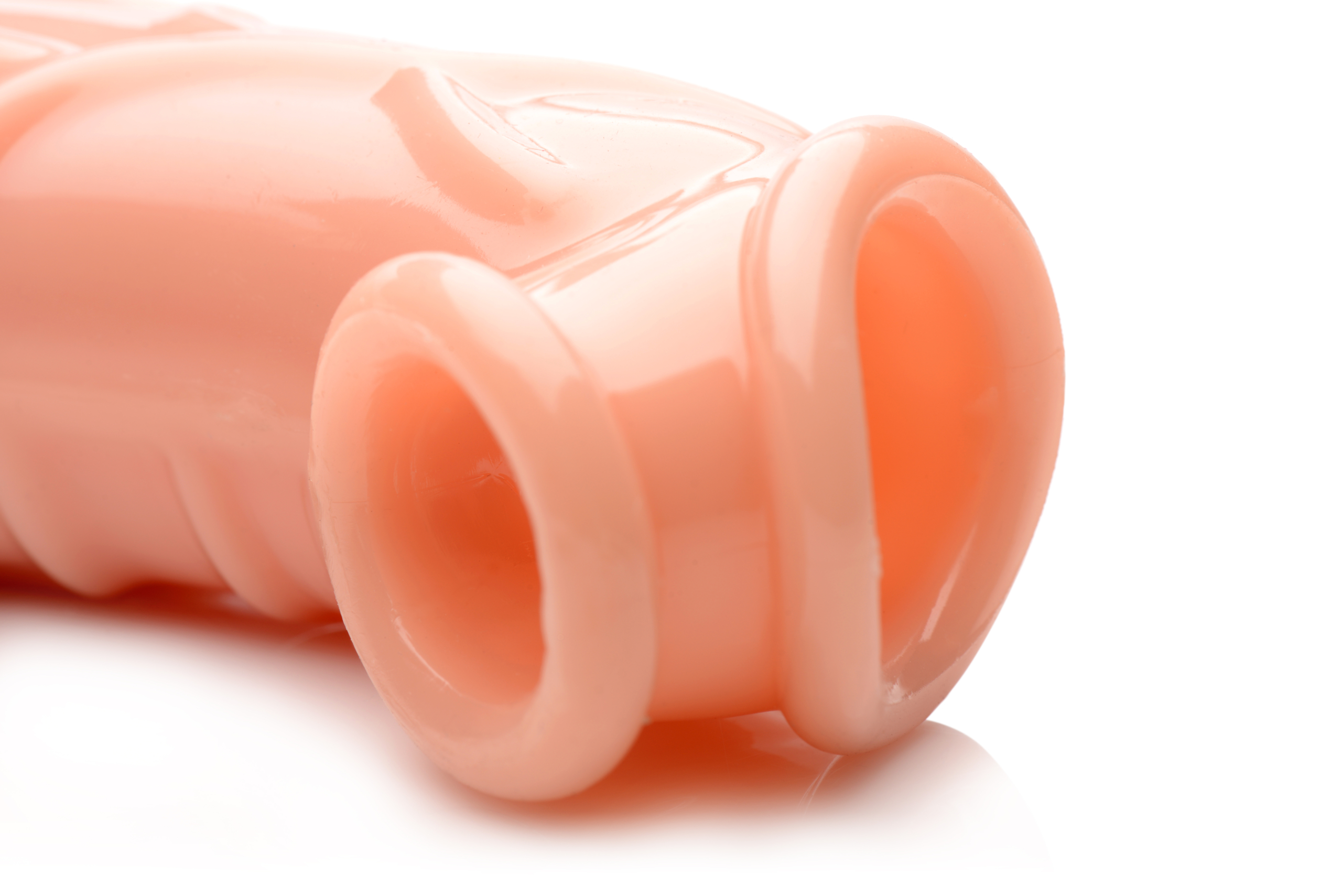 allowing your scrotum to go through the bottom hole for a satisfying stretch. The solid 2 inch tip is followed by a hollow interior that allows for a snug and secure fit. This body-safe and phthalate-free material is compatible with silicone and water-based lubricants. Use warm water and mild soap or a toy cleaner to clean after use.