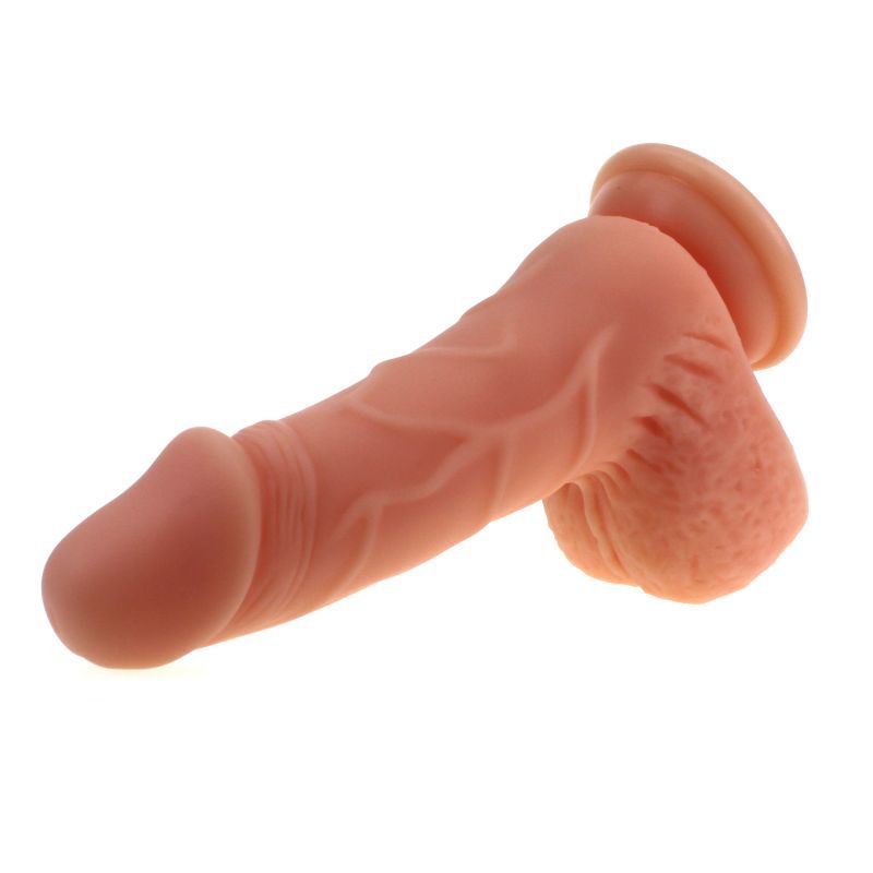 Large Penis shaped dildo with balls on a suction base in flesh colour