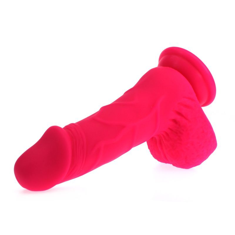 Large Penis shaped dildo with balls on a suction base in pink colour