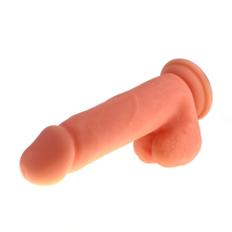 Large Penis shaped dildo with balls on a suction base in flesh colour