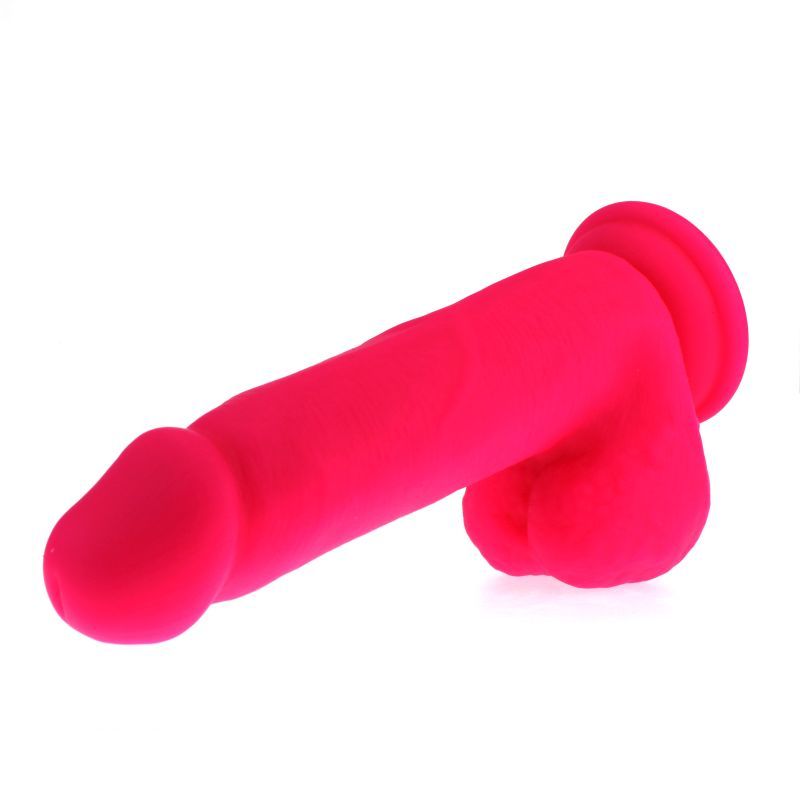 Large Penis shaped dildo with balls on a suction base in pink colour