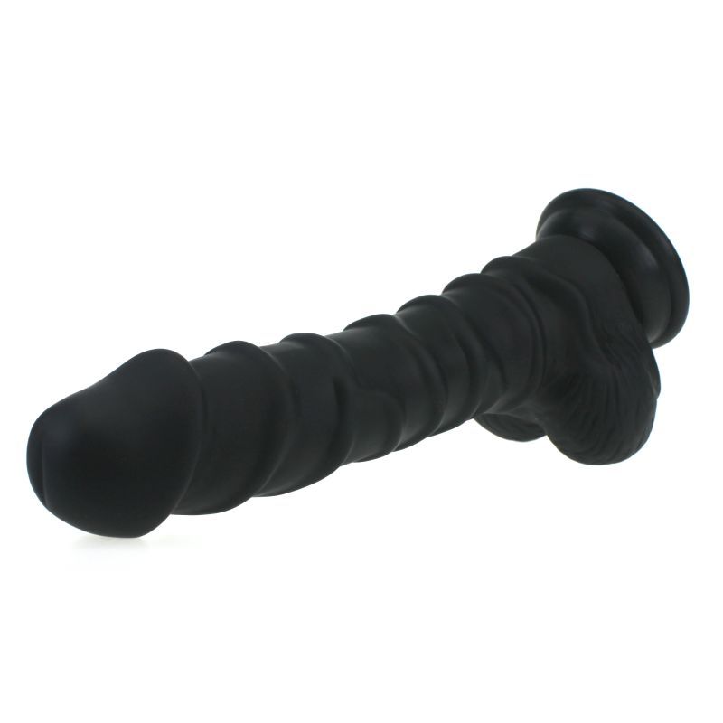 Large Penis shaped dildo with balls and ridged shaft on a suction base in flesh colour.
