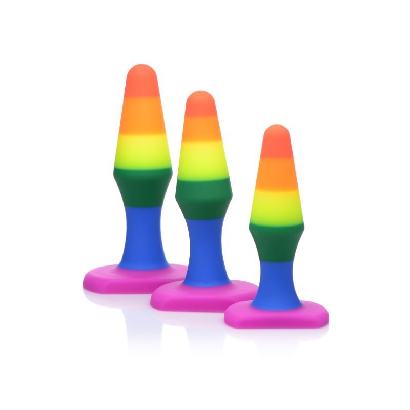 Take pride in your anal play! A colorful little set perfect for backdoor training. The premium silicone is velvety to the touch and the tapered tips make for a gentle insertion while you have fun working your way up in sizes. The flexible neck make these perfect for solo discovery or to use with a partner. The smallest of the plugs very gently stretches the anal opening at 4.1" making it perfect for beginners. The next is 4.7" for more intermidiate users and the last is 5.2" for a much more filling feeling. Great for newcomers and experienced users alike. These satin finish toys are easy to clean and safe to use with water based lubricants.
