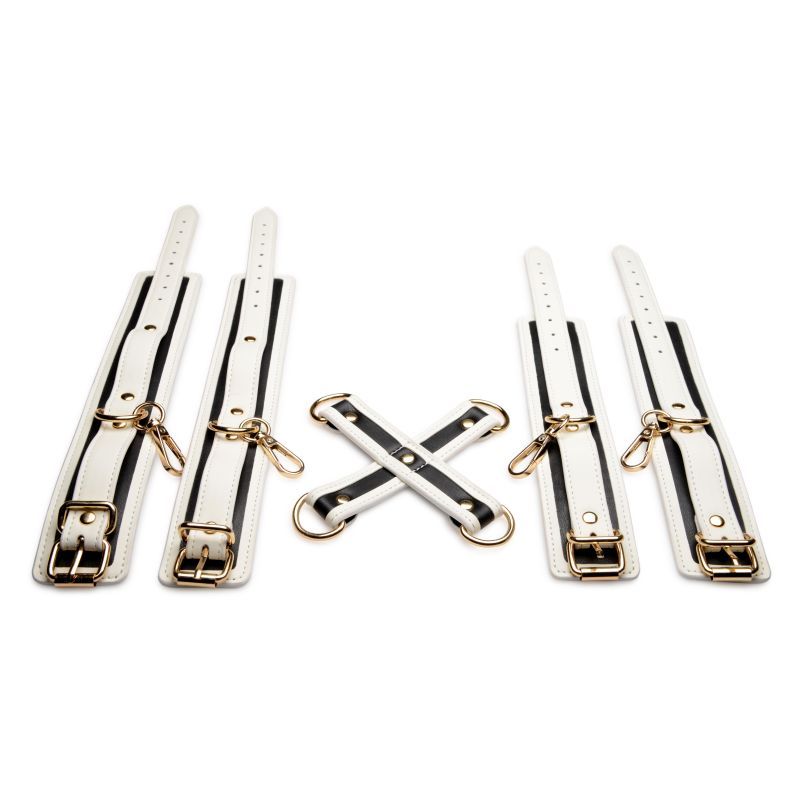 Add a kinky glow to your bedroom bondage fun! This Glowing Hog Tie Set makes it easy to tie your lovers limbs behind their back so you can enjoy their body to your hearts content. The white PU Leather and golden metal hardware add an elegant touch!The cuffs adjust to fit
