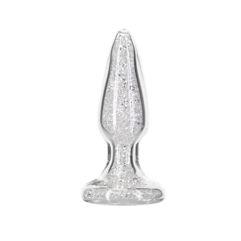 Experience ultimate elegance with Fancy. This shimmering glass anal toy’s interior is filled with sparkling mini glass beads and features an exquisitely sculpted gem base. Its tapered shape and glossy
