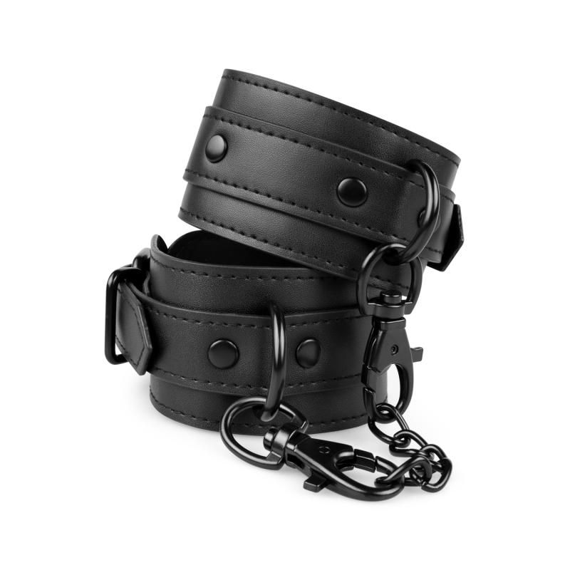 These adjustable cuffs are made of durable faux leather and equipped with clip closures and a chain.