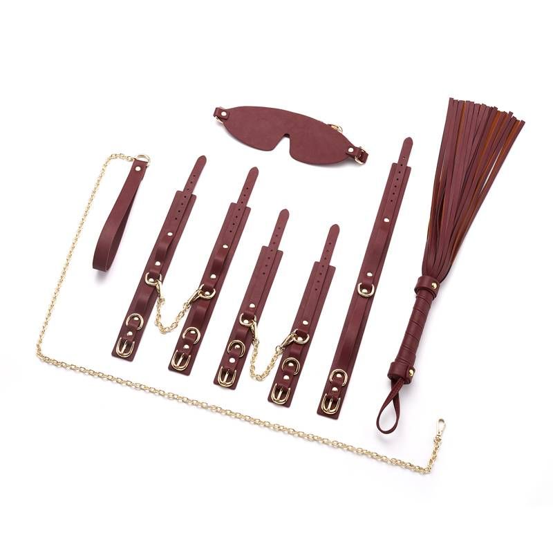 This deluxe 8 Piece Faux Leather BDSM Restraint Kit is finished in elegant burgundy with gold metal trim hardware and durable gold chains.